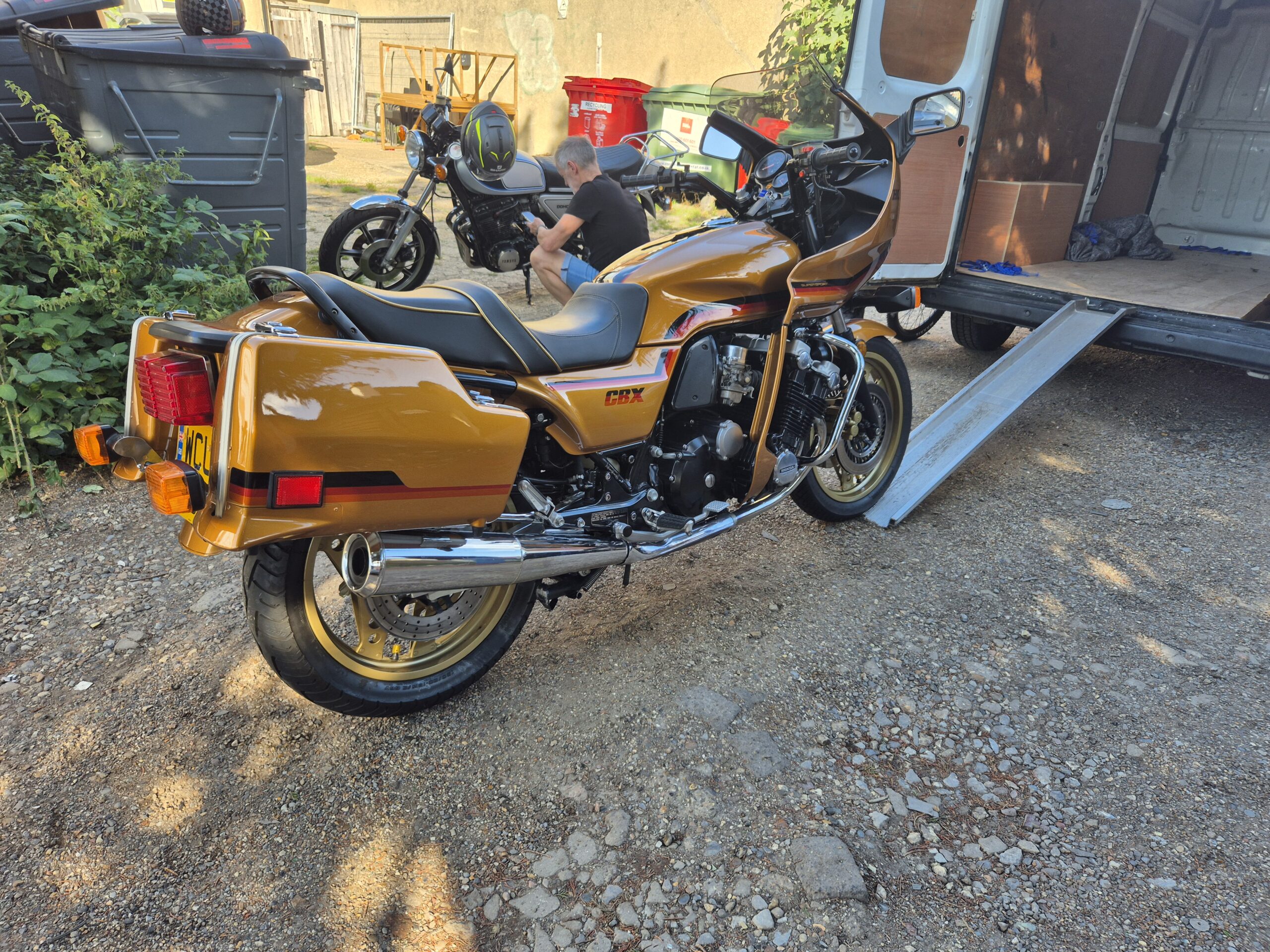 A Honda CBX1000 being load onto a van - motorcycle delivery service