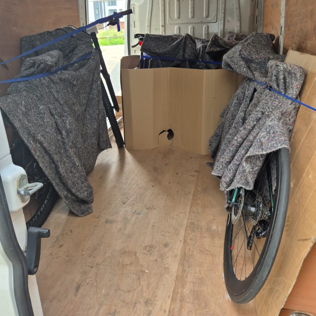 bicycles and e-bikes secured for transport in the back of a van - e-bike and bicycle courier service - unboxed bike delivery