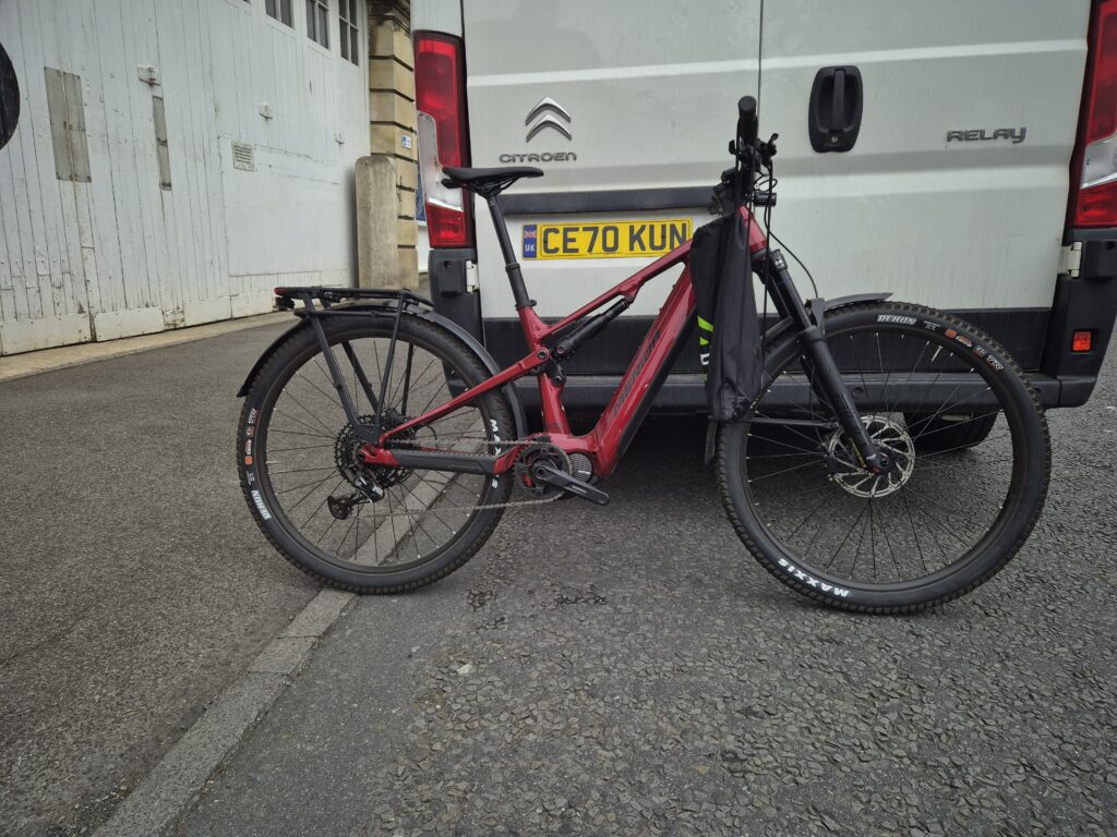 a merida e-bike next to a van - unboxed e-bike & bike delivery